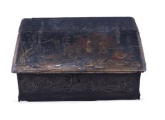 A BLACK LACQUER AND CHINOISERIE DECORATED OAK WRITING BOX, CIRCA 1660