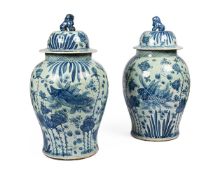 A PAIR OF ASIAN BLUE AND WHITE 'FISH POND' BALUSTER JARS AND COVERS, MODERN