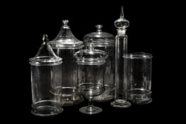 SIX VARIOUS CLEAR GLASS STORAGE JARS AND FIVE COVERS
