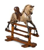 λ A GAMMAGES 'BRONCO' PATTERN CARVED AND PAINTED WOOD ROCKING HORSE, FIRST QUARTER 20TH CENTURY