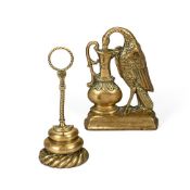 TWO VICTORIAN BRASS DOOR PORTERS OR DOOR STOPS, 19TH CENTURY