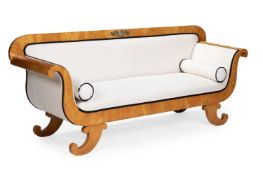 A NORTH EUROPEAN BIRCH AND BRASS MOUNTED BIEDERMEIER SOFA, CIRCA 1830