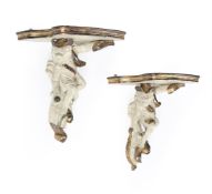 A PAIR OF CARVED, PAINTED AND PARCEL GILTWOOD WALL BRACKETS, 20TH CENTURY