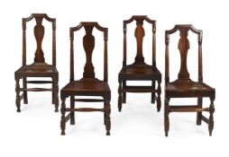 A SET OF FOUR OAK BACK STOOLS OR SINGLE CHAIRS, PROBABLY NORTH COUNTRY, FIRST QUARTER 18TH CENTURY