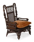 A WICKER WORK HIGH BACK ARMCHAIR PROBABLY AMERICAN
