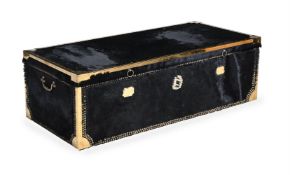 A HIDE COVERED AND BRASS MOUNTED TRUNK, OF RECENT MANUFACTURE