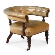 A VICTORIAN MAHOGANY AND LEATHER UPHOLSTERED ARMCHAIR, IN THE MANNER OF HOLLAND AND SONS