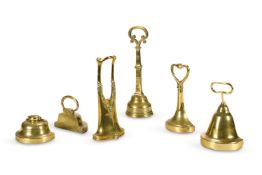 A GROUP OF SIX BRASS DOOR PORTERS OR DOOR STOPS 19TH AND EARLY 20TH CENTURY Including a pair lar