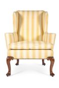 A GEORGE II WALNUT WING ARMCHAIR, CIRCA 1730