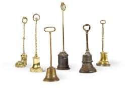 A GROUP OF SIX BRASS AND CAST IRON DOOR PORTERS OR DOOR STOPS, 19TH AND EARLY 20TH CENTURY