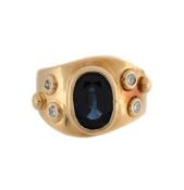 A SAPPHIRE AND DIAMOND DRESS RING The oval cut sapphire within a raised collet setting