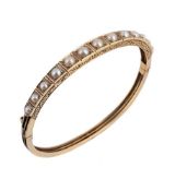 A HALF PEARL BANGLE