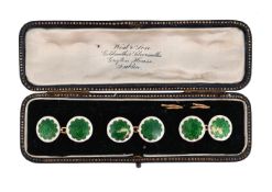 A SET OF THREE ENAMELLED CUFFLINKS
