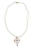 AN EDWARDIAN AQUAMARINE AND SEED PEARL PENDANT ON SEED PEARL CHAIN