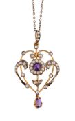 AN EDWARDIAN AMETHYST AND HALF PEARL PENDANT