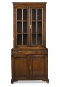 A WALNUT 'PEYPSISAN' TYPE CUPBOARD BOOKCASE, POSSIBLY BY TOZER OF LONDON, CIRCA 1890