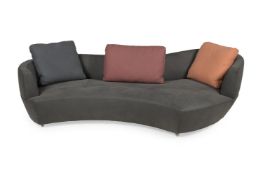 ROCHE ROBOIS, A TEXTURED LEATHER CURVE SOFA, MODERN