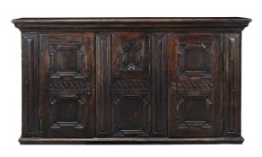A CARVED OAK PANELLED SIDE CABINET, CIRCA 1800 AND LATER
