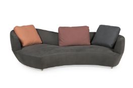 ROCHE ROBOIS, A TEXTURED LEATHER CURVE SOFA, MODERN