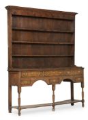 A GEORGE III PROVINICIAL OAK DRESSER AND RACK, CIRCA 1800