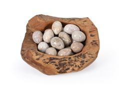 A COLLECTION OF EIGHTEEN CARVED STONE MODELS OF EGGS, SECOND HALF 20TH CENTURY
