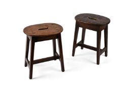 A PAIR OF VERNACULAR MAHOGANY STOOLS, FIRST HALF 19TH CENTURY