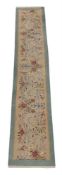 A LIGHT BLUE AND IVORY KERMAN STRIP RUNNER IN THE EUROPEAN MANNER, PROBABLY SECOND HALF 20TH CENTURY