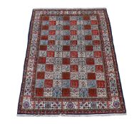 † A QUM CARPET, CIRCA 1960