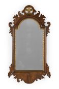 A WALNUT AND PARCEL GILT MIRROR, IN GEORGE II STYLE, EARLY 20TH CENTURY