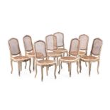 A SET OF EIGHT CREAM AND SILVERED WOOD DINING CHAIRS, IN THE LOUIS XV STYLE, CIRCA 1900