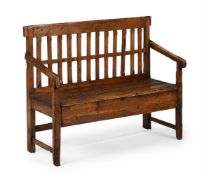 A PRIMITIVE PINE HALL BENCH OR SETTLE, MID 19TH CENTURY
