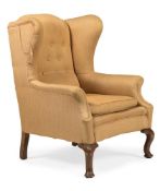 A WALNUT AND UPHOLSTERED WING BACK ARMCHAIR, CIRCA 1900