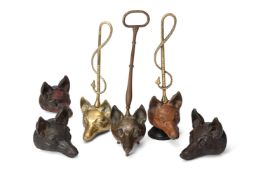 SIX CAST BRASS, IRON AND BRONZE FOX HEAD DOOR PORTERS OR STOPS, LATE 19TH AND EARLY 20TH CENTURY
