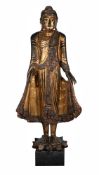 A LARGE BURMESE GILTWOOD STANDING FIGURE OF BUDDHA, LATE 19TH OR EARLY 20TH CENTURY