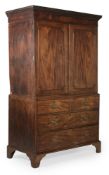 A GEORGE III FIGURED MAHOGANY LINEN PRESS CUPBOARD, CIRCA 1790