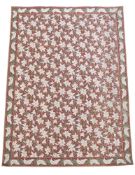 AN ARTS & CRAFTS 'LILLY' PATTERN MACHINE FLAT WOVEN CARPET, 20TH CENTURY