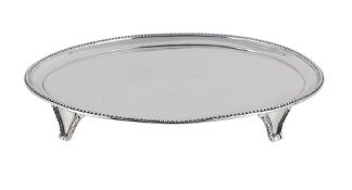 A GEORGE III SILVER OVAL TEA POT STAND