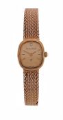BUECHE-GIROD, A LADY'S 9 CARAT GOLD BRACELET WATCH