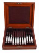 Y A CASED SET OF TWELVE VICTORIAN SILVER AND MOTHER OF PEARL FRUIT EATERS