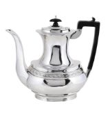 AN EDWARDIAN SILVER OVAL BALUSTER COFFEE POT