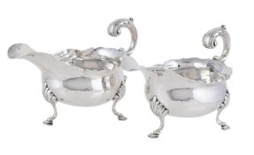 A PAIR OF GEORGE III SILVER SHAPED OVAL SAUCE BOATS