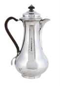 A GEORGE III SILVER BALUSTER WATER JUG