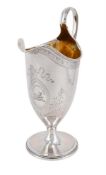 A GEORGE III SILVER HELMET SHAPED CREAM JUG
