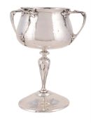 A SILVER THREE HANDLED CUP