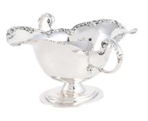 AN EDWARDIAN SILVER TWIN HANDLED SAUCE BOAT