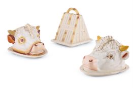 TWO SIMILAR STAFFORDSHIRE POTTERY CHEESE DISHES AND COVERS, MODELLED AS BULLS HEADS, LATE 19TH C