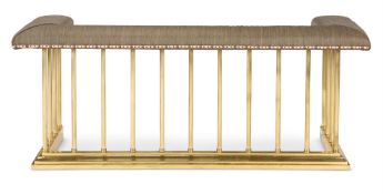 AN UPHOLSTERED BRASS CLUB FENDER 20TH CENTURY Upholstered in Osborne and Little fabric 60cm hi