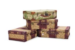 A SET OF THREE UPHOLSTERED SUITCASES IN OSBORNE AND LITTLE FABRIC, MODERN