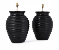 A PAIR OF RIBBED EBONISED WOOD LAMP BASES, BY ANTONY LITTLE