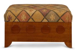 A BIRCH AND KELIM UPHOLSTERED OTTOMAN BY ANTONY LITTLE The hinged seat above a pierced and roundel
